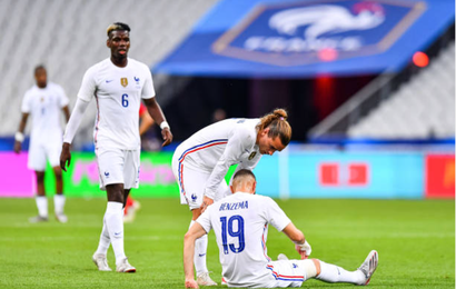 Paul POGBA of France, Antoine GRIEZMANN of France and Karim BENZEMA of France who lies on the pitch injured during the international friendly match between France and Bulgaria
