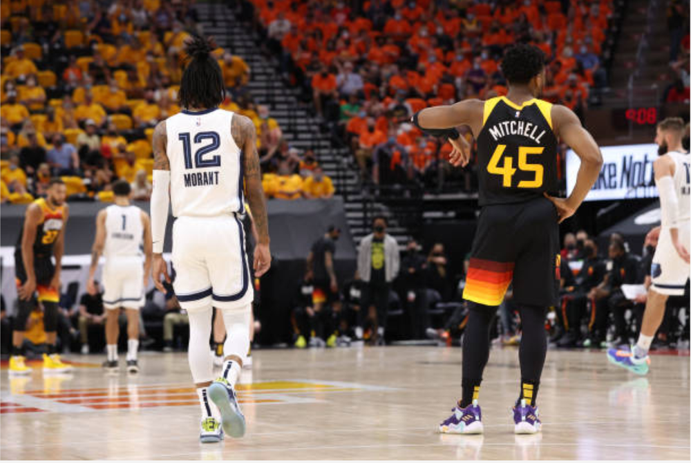 Ja Morant #12 of the Memphis Grizzlies and Donovan Mitchell #45 of the Utah Jazz look on during Round 1, Game 5 of the 2021 NBA Playoffs