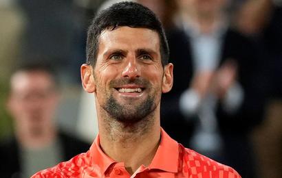 Novak Djokovic smiles after beating Marton Fucsovics