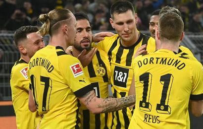 Reus and Can send Dortmund three points clear